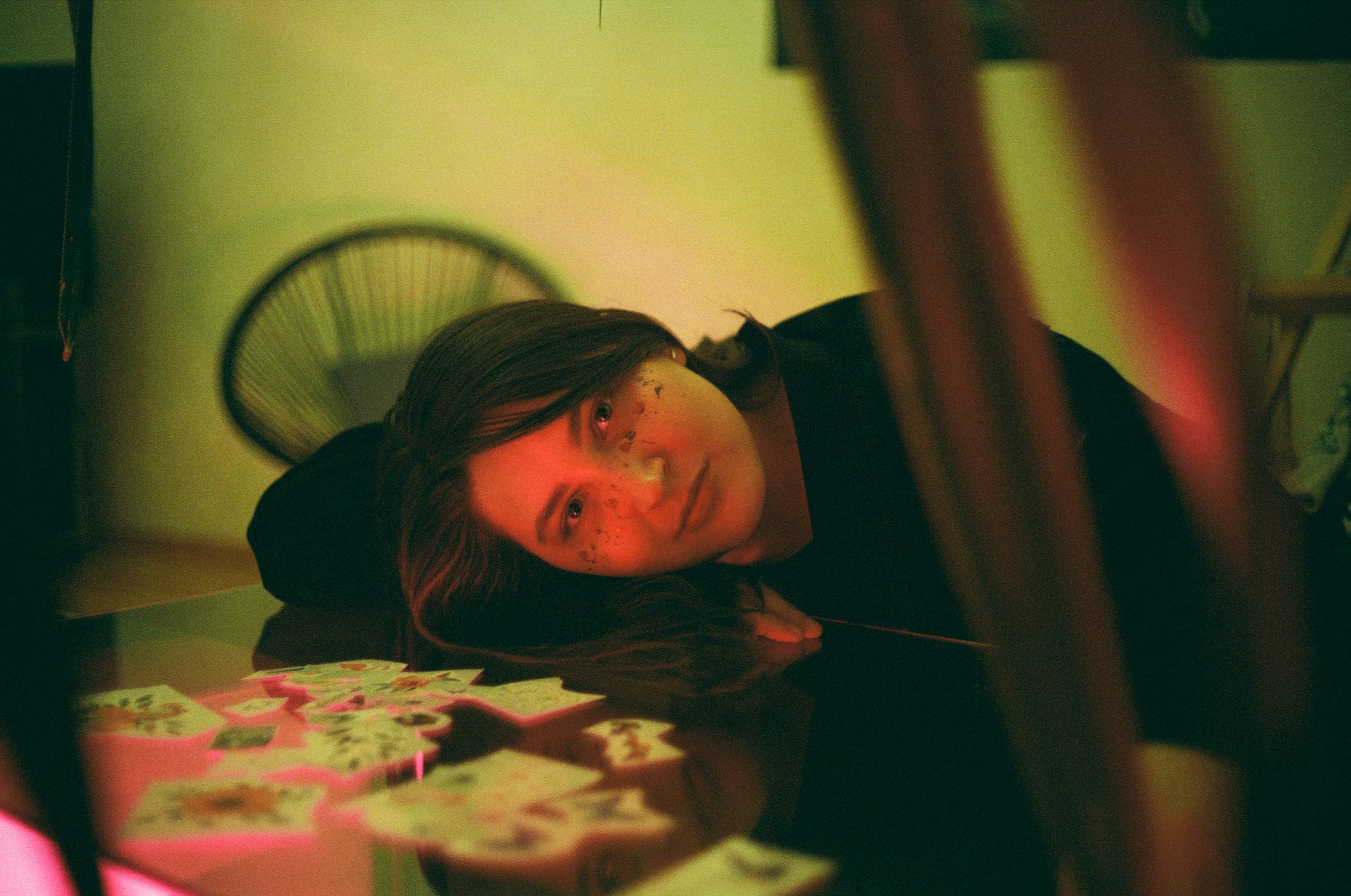 woman in black shirt lying on bed